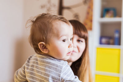 Portrait of cute baby girl at home