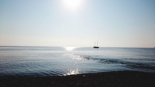 Scenic view of sea against clear sky during sunset