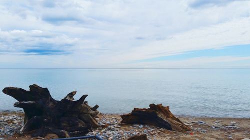 Scenic view of sea against cloudy sky