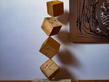 High angle view of carving on table against wall at home