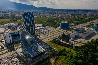 High angle view of buildings in city against sky