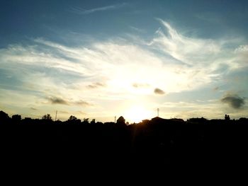 Silhouette landscape against sky during sunset