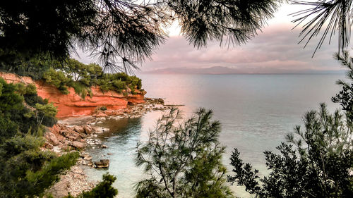 Scenic view of beach against sky during sunset