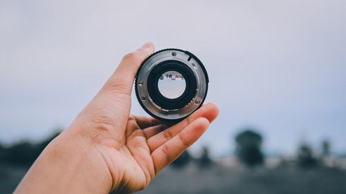 Close-up of hand holding camera