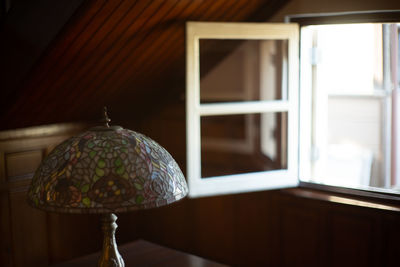 Low angle view of illuminated electric lamp