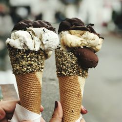 Close-up of hand holding ice cream