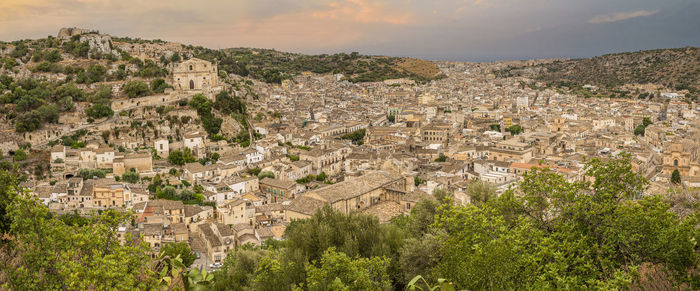 Wide aerial landscape of scicli with beautiful historic buildings in the baroque style at sunset