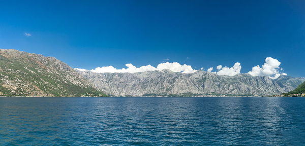 Scenic view of sea against blue sky