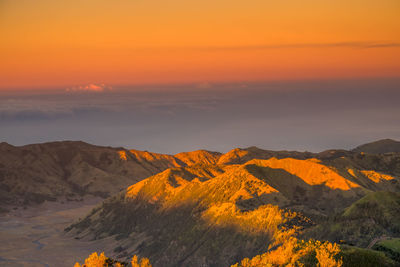 Scenic view of mountains against sky during sunset