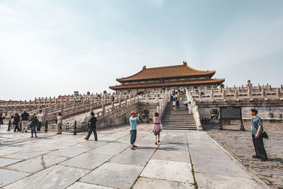 Group of people in front of historical building