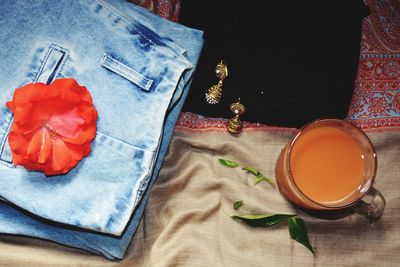 High angle view of tea cup with textile on table