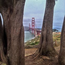 Distant view of golden gate bridge against sky