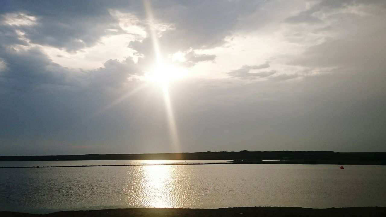 sun, water, tranquil scene, tranquility, scenics, sky, reflection, beauty in nature, sunbeam, sea, sunlight, nature, cloud - sky, waterfront, idyllic, sunset, lens flare, horizon over water, cloud, outdoors