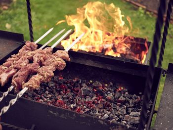 Close-up of meat on barbecue grill