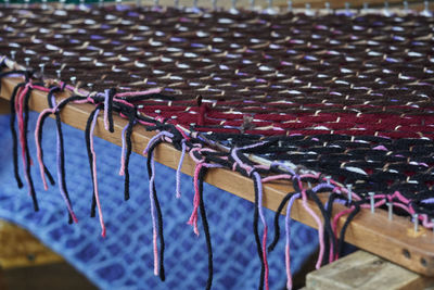 High angle view of multi colored umbrellas hanging on metal