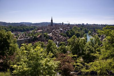 High angle view of trees and buildings against sky