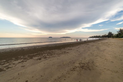 Scenic view of beach against sky during sunset