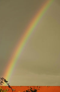 Low angle view of rainbow against sky