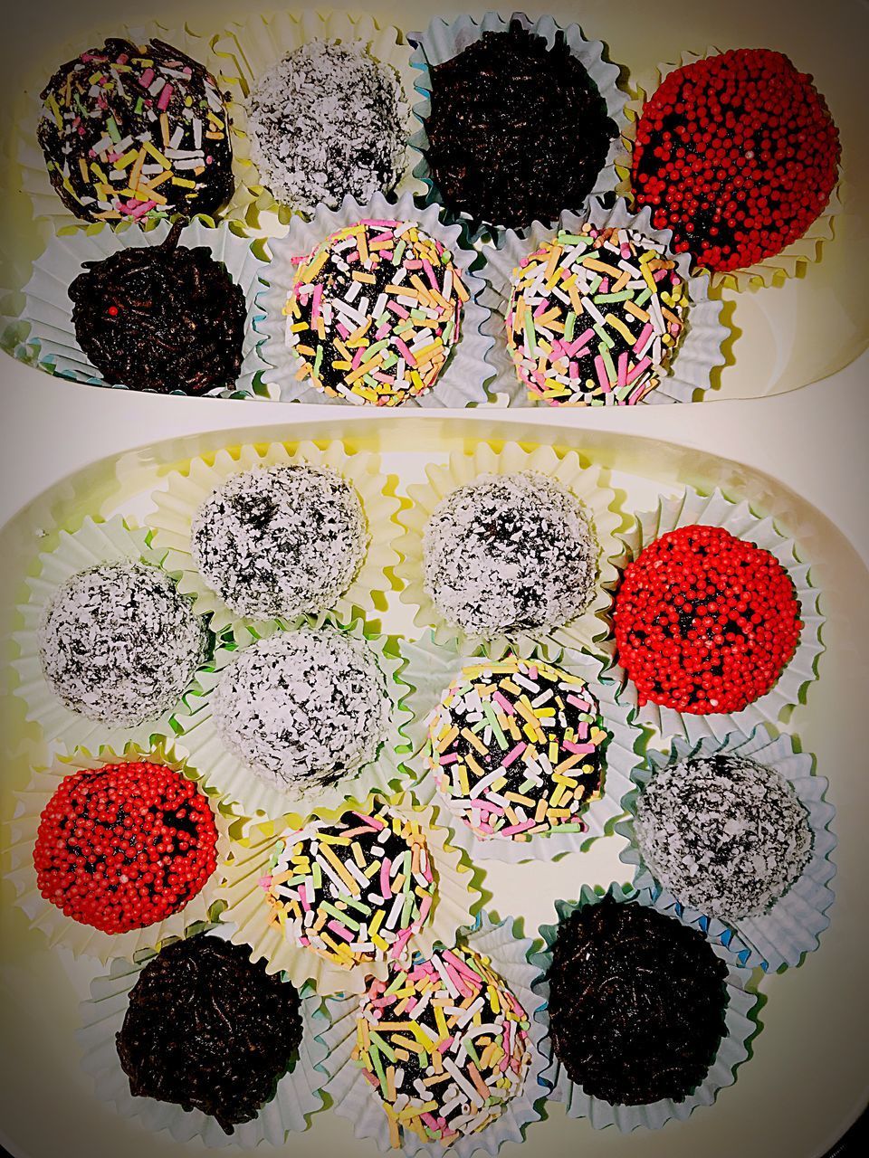 HIGH ANGLE VIEW OF MULTI COLORED CANDIES ON TABLE