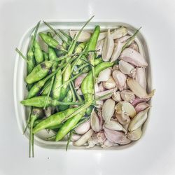 Close-up of fruit over white background