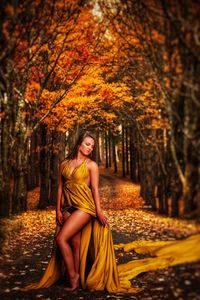 Portrait of beautiful young woman in autumn