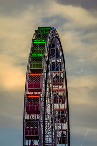 Low angle view of ferris wheel against sky