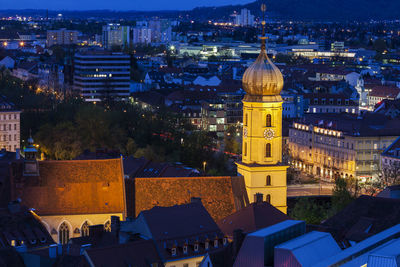 High angle view of buildings in city at night