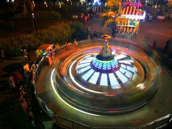 Illuminated ferris wheel at night