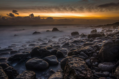 Scenic view of sea against sky during sunset