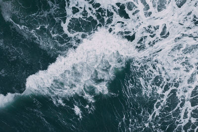 High angle view of water splashing in sea