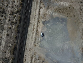 Aerial view of car by railroad track