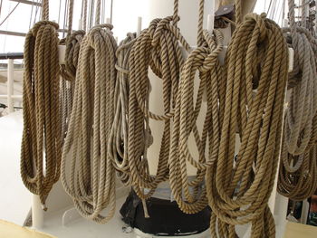 Close-up of tied hanging on rope