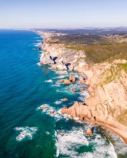 High angle view of rocks in sea against sky