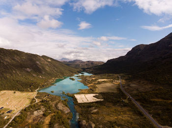 Scenic view of lake and mountains against sky