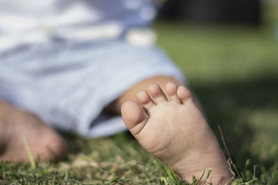 Baby foot sitting in a park