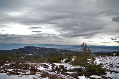 Scenic view of mountains against sky during winter