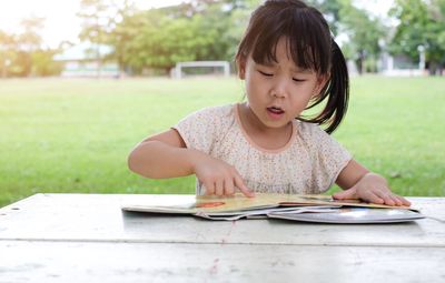 Girl sitting on table