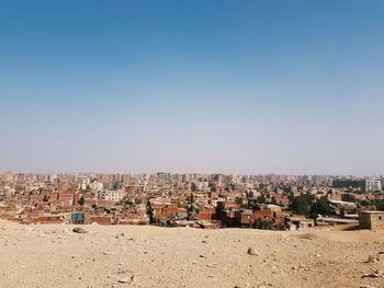 High angle view of buildings against clear sky