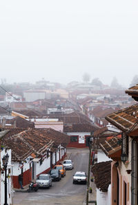 High angle view of buildings in city against sky