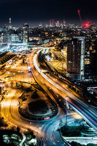 High angle view of light trails on highway at night