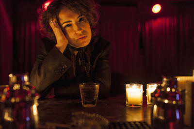 Woman enjoying a drink at a bar