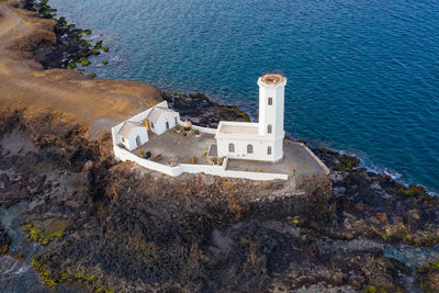 High angle view of rock by sea