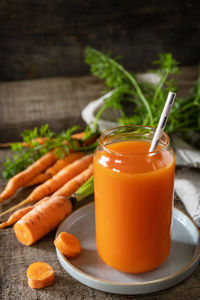 Close-up of orange juice on table