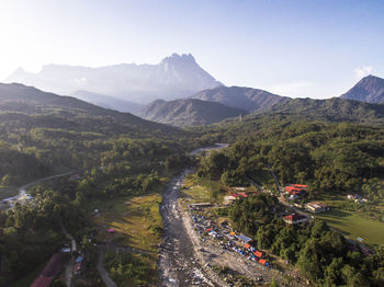 High angle view of road by mountains against sky