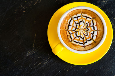 High angle view of coffee cup on table