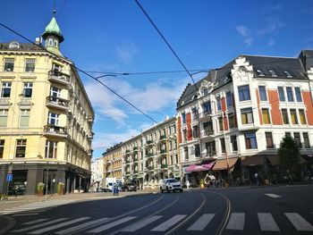 Vehicles on road along buildings