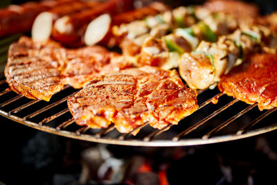 Close-up of meat on barbecue grill