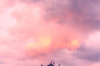 Low angle view of dramatic sky during sunset