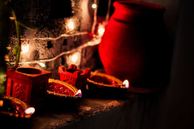 Lit candles on burning candle