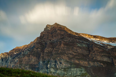 Low angle view of rock formation against sky